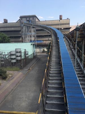 Sistemas de transporte de cinta de tubos cerrados para el transporte de material a granel libre de polvo curvado